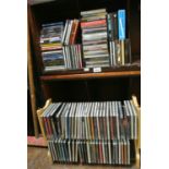 A collection of mixed CDs, some on a free standing stand - various genres, classical, rock,