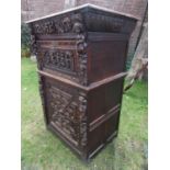 19th century oak cabinet in an Elizabethan manner, the lower section enclosed by a panelled door