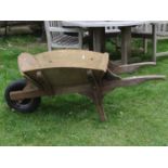 A traditional wooden wheelbarrow with pneumatic tyre