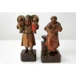 2 Arni (Italian) wood carved figures, old man holding a mall child ad a man proudly holding a pair