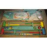 A "Junior" croquet set for four players in original but tired cardboard box