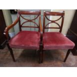 A set of eight (6+2) Regency mahogany dining chairs with X shaped splats raised on turned