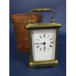 Brass cased carriage clock, 11cm high, with Morocco leather carry case and key