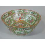 A late 19th century canton famille rose porcelain bowl, decorated with panels of figures and