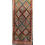 Choli Kelim runner with multi coloured medallion decoration, 250 x 75cm