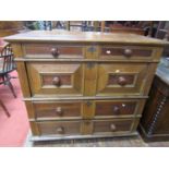 An early 18th century oak and fruitwood two sectional chest of drawers, the four drawers of