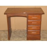 A small vintage child's size oak kneehole single pedestal desk fitted with four drawers within a