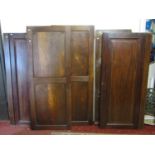 Two pairs of 19th century cupboard doors in oak and mahogany, together with a further antique oak
