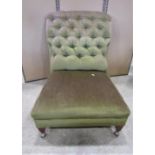 An unusual late Victorian/Edwardian low generous upholstered chair with buttoned and scrolled