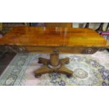 A William IV rosewood centre table of rectangular form, raised on a cylindrical column and