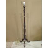 A standard lamp in the hepplewhite style, the turned and reeded column with wheat sheaf detail and