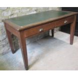 A vintage oak office table of rectangular form, with faux leather inset top over two frieze drawers,