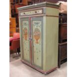 A 19th century pine side cupboard with hand painted floral and further detail, freestanding and