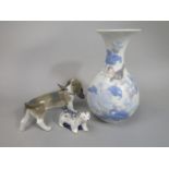 A Lladro model of a Bassett Hound chasing its tail, 21cm long approx, together with a Lladro vase