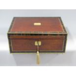 Good quality amboyna and rosewood cross banded brass bound writing slope, the hinged lid enclosing
