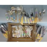 A box containing a large collection of silver plated flatware comprising bone handled knives,