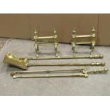 A set of three good quality late Victorian brass fire irons with etched foliate and gothic detail,