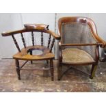 A Regency mahogany child's bergere chair with turned supports, cane panelled seat and back panels,