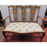 An inlaid Edwardian mahogany parlour room settee, with triple splat back, carved and pierced