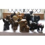 A collection of ceramic and other models of dogs including Scottie dogs, terriers, studio pottery