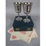 Pair of silver goblets engraved with coat of arms and 1373 - 1973, each with a certificate inscribed