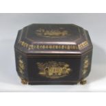 A Japanese lacquered tea caddy, the hinged lid enclosing two sheet metal canisters upon carved paw