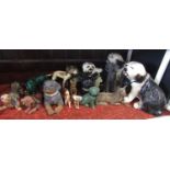 A collection of ceramic and other models of dogs including three large models of seated Old