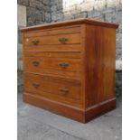 An Edwardian satin walnut bedroom chest of three long drawers set on a moulded plinth, 3ft wide