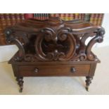 A Regency rosewood four divisional Canterbury, with shaped outline, C scroll and other detail over a