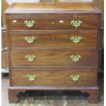 A small Georgian mahogany chest of four long graduated drawers, together with a brush slide, the top