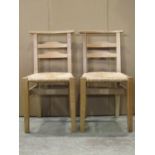 A set of six good quality ashwood chapel type chairs with rush seats, low ladderbacks, exposed