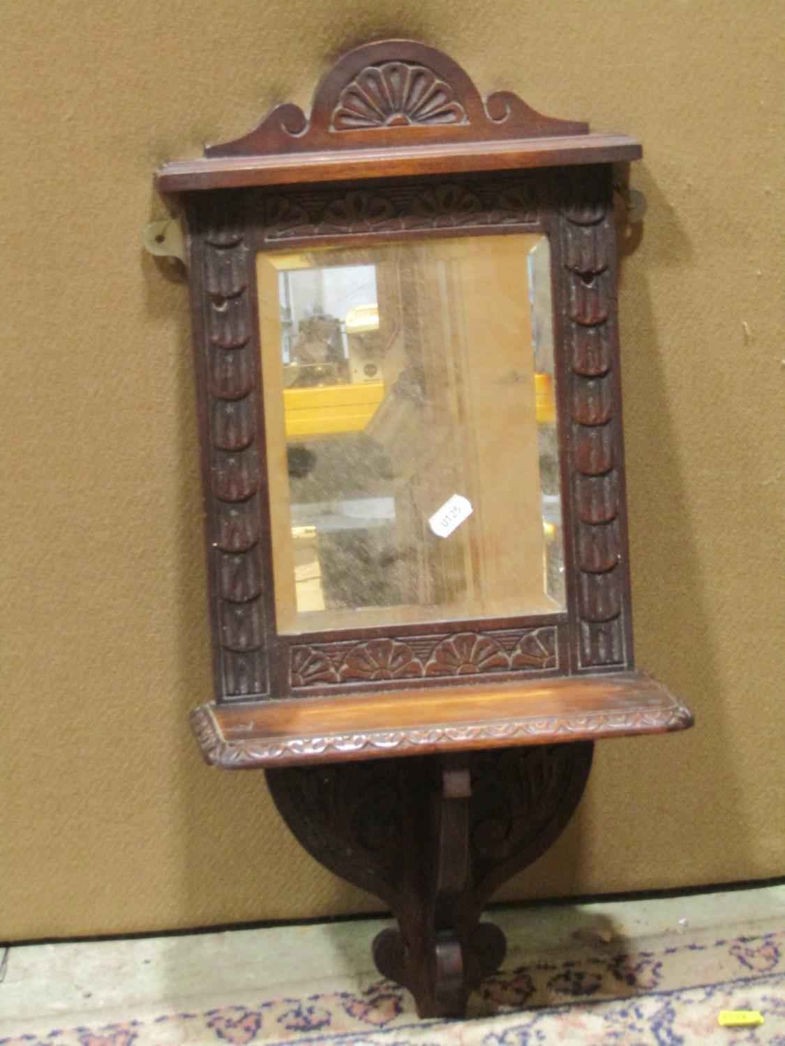 A Victorian oak hall shelf/mirror with carved foliate pediment and moulded frame enclosing two - Image 2 of 2