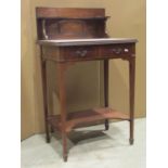 A small inlaid Edwardian mahogany washstand with box wood stringing, shallow raised panelled back