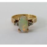18ct three stone opal and diamond ring in raised setting, size M, 3.6g