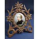 19th century German porcelain panel, oval, female in medieval costume, hand painted in a carved