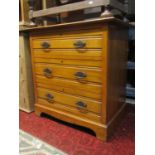 An Edwardian satin walnut bedroom chest of three long drawers with moulded detail, 84 cm wide