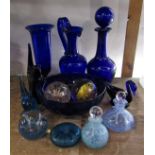 A collection of Bristol Blue glass comprising decanter, jug, vase, two novelty paperweights and