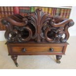A flamboyant Regency rosewood four divisional Canterbury, with acanthus, C scroll, raised on