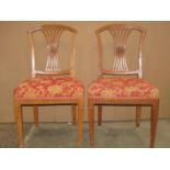 A set of five 19th century dining chairs, the shield shaped backs with pierced comb splats and