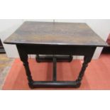 A small Old English oak occasional table of rectangular form, the top with carved geometric