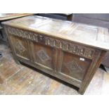 An 18th century panelled oak coffer with original carved detail, raised on moulded styles, 120cm