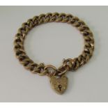 Edwardian 9ct curb link bracelet with engraved heart padlock clasp and textured links, 16.5g