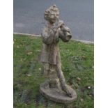 A weathered cast composition stone garden figure "pan" raised on an oval platform base, 86 cm