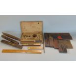 Five vintage wooden handled set squares of graduated size, four small spirit levels, two boxwood