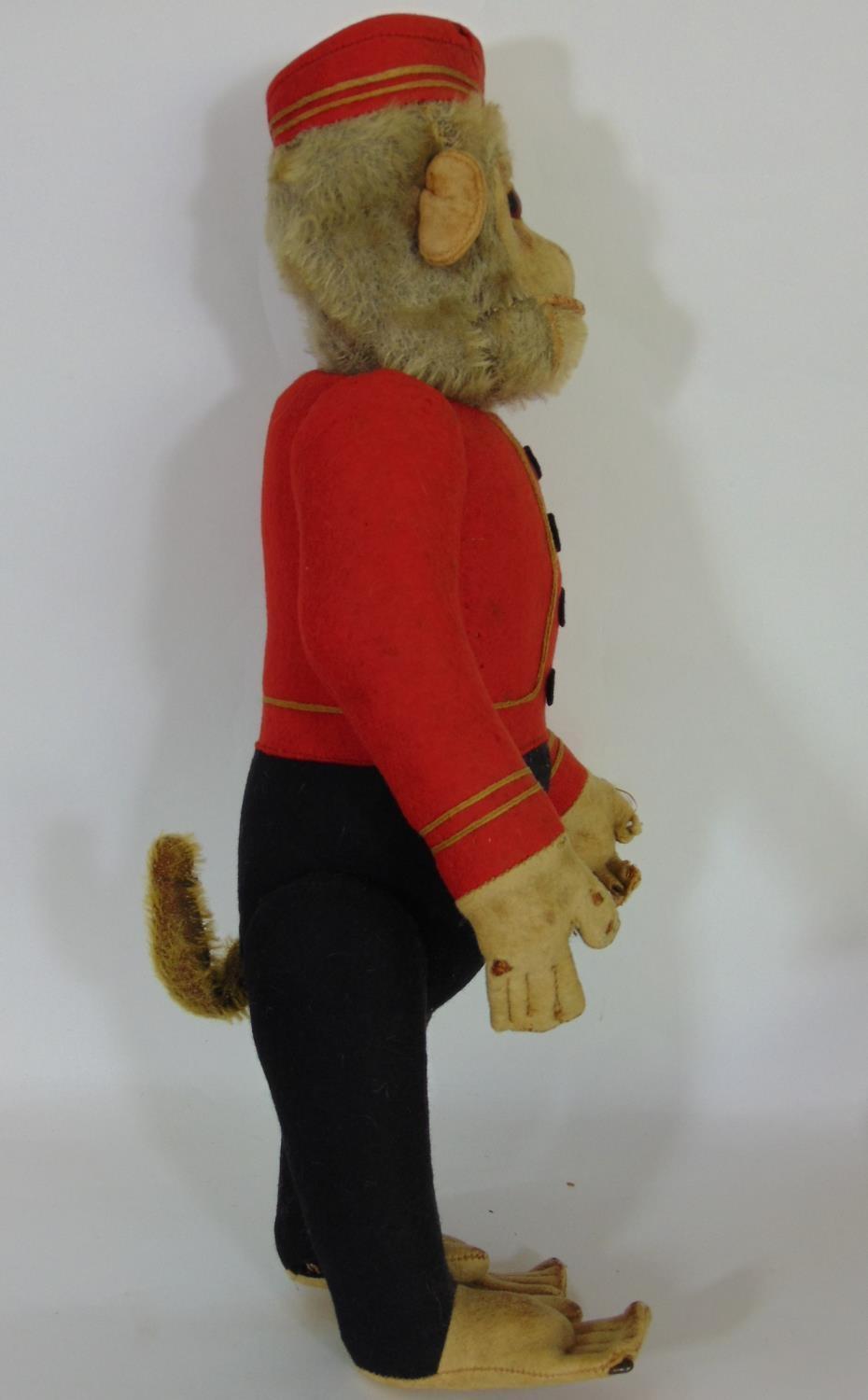 Schucco Bellhop Yes/ No monkey C1920's with brown glass eyes, fur head, felt face, in red and - Image 4 of 11