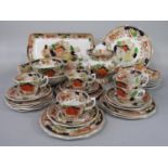 A collection of T Hughes & Son Longport Pottery teawares in the Swiss Pastimes pattern comprising