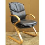 A Senator good quality contemporary office chair with soft black hide upholstery, raised on