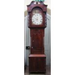 A Regency mahogany longcase clock, the case with well figured flamed veneered door, within reeded