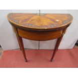 19th century satinwood D end fold over top card table in the Sheraton manner, raised on four