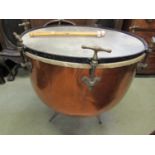 A copper kettle drum with screw fittings and adjustable tripod supports, 70 cm in diameter approx
